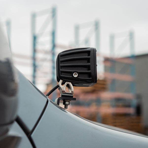 Side view of the low profile ditch light bracket and RIGID pod beside the Lexus GX470 windshield pillar