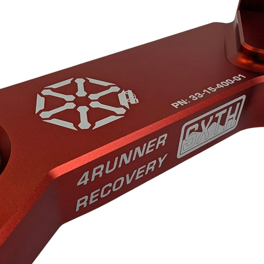 Close-up of SXTH Element branding and part marking on red 4Runner recovery point