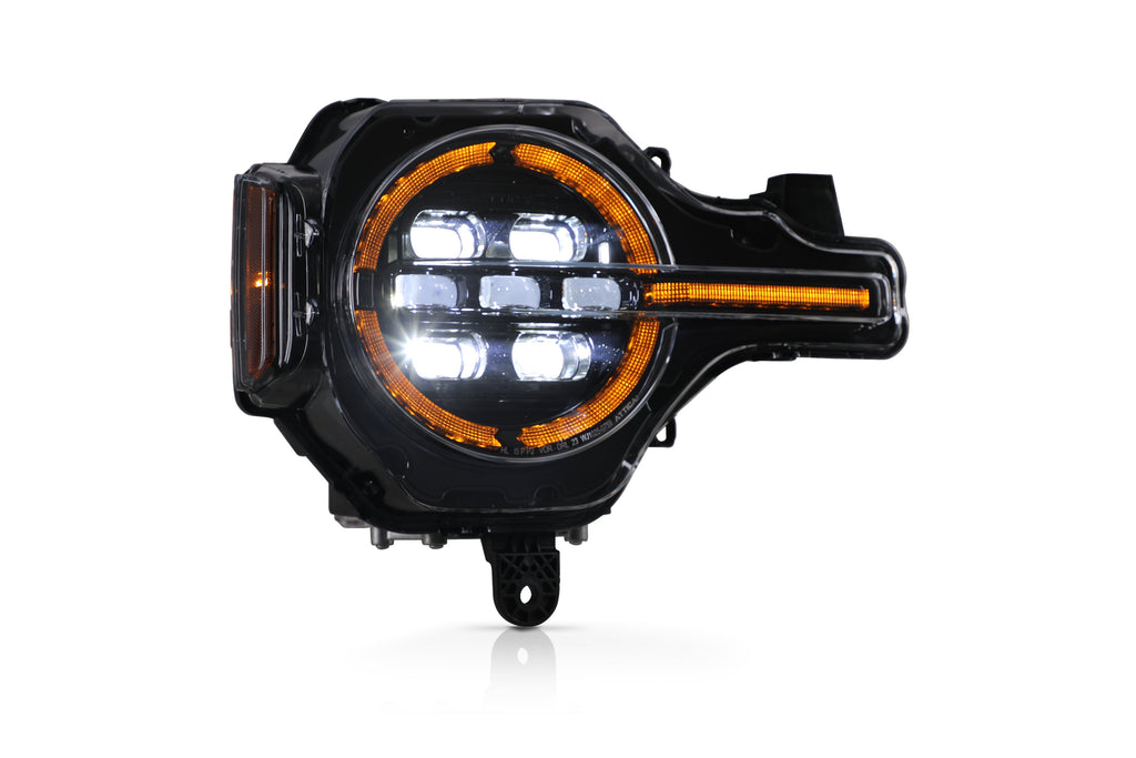 Attica Apex Series Bronco headlight with amber DRL and LED projectors lit
