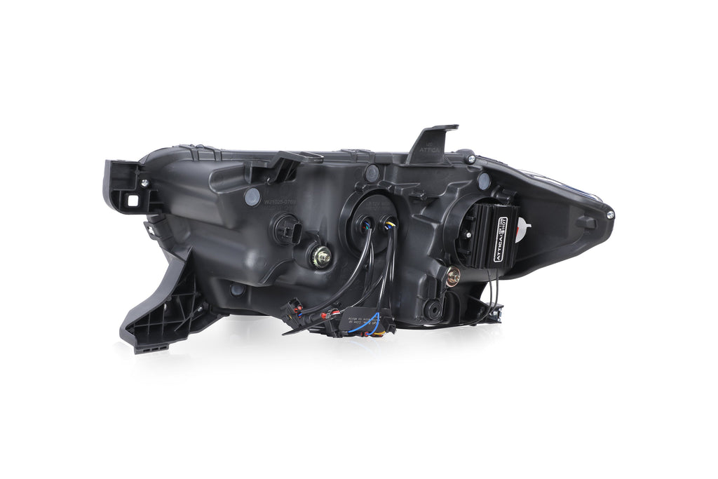 Rear of Attica Apex Series Tacoma headlight housing showing wiring and mounting points