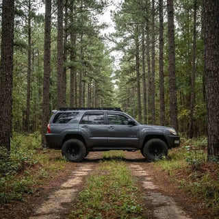 Cali Raised LED Trail Edition rock slider shown at its tucked 20-degree mounting angle on a 2003-2009 Toyota 4Runner