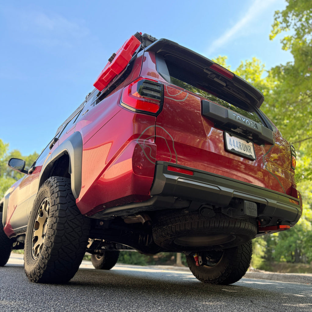 Low rear view of a 2025+ Toyota 4Runner with red recovery point