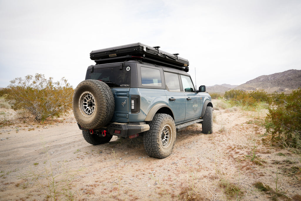 Ford Bronco on a desert trail with Attica Sol Series tail lights