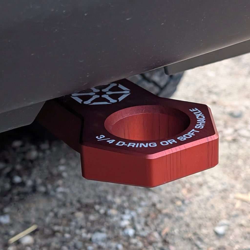 Installed red recovery point showing 3/4-inch D-ring or soft shackle marking