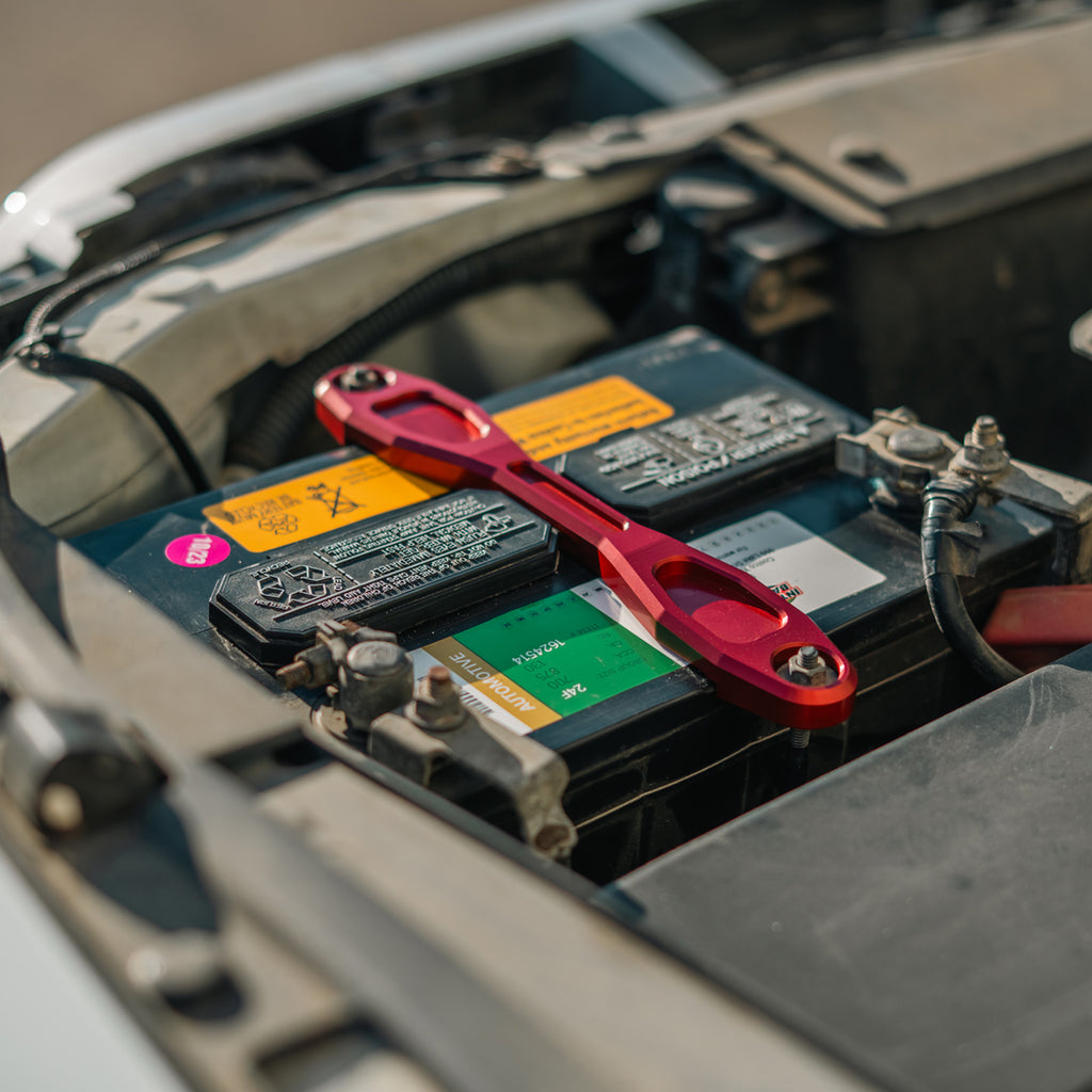 Red anodized battery clamp mount installed
