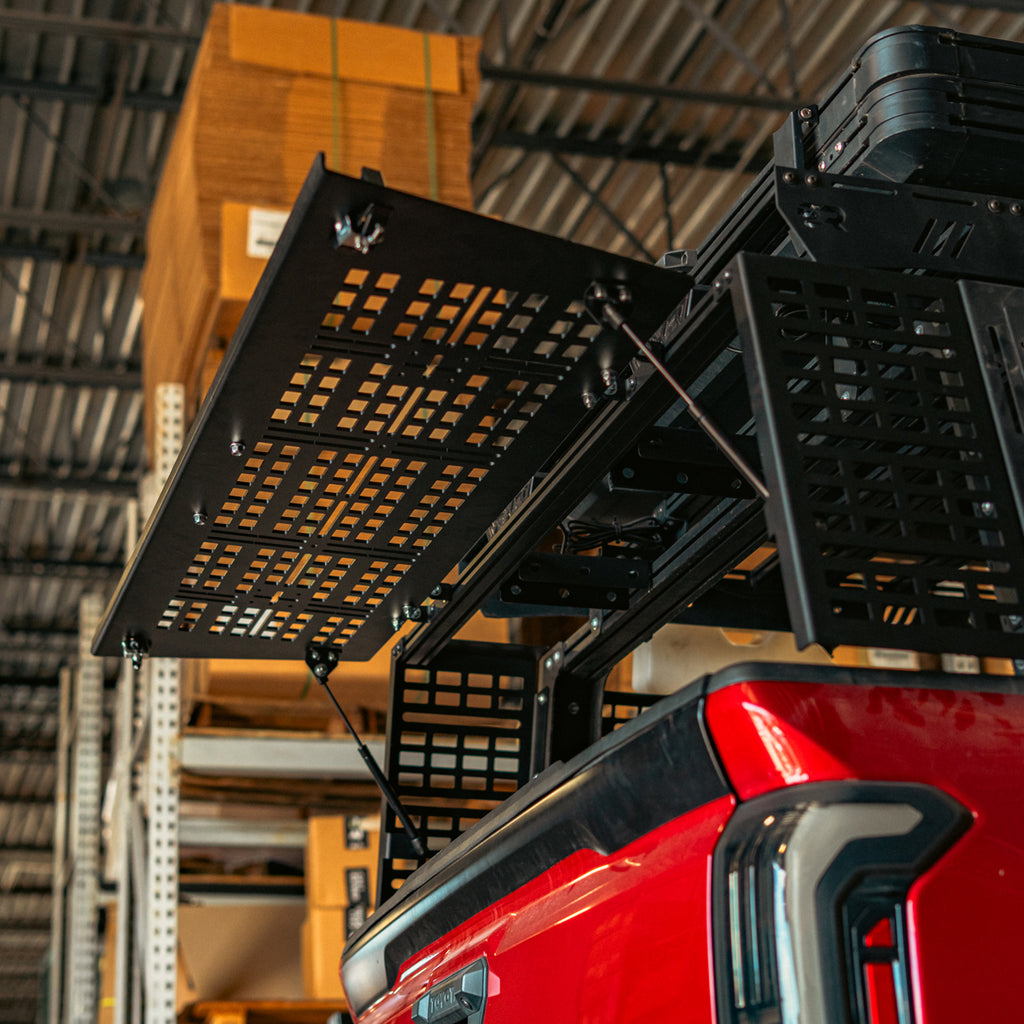 Toyota Tacoma bed rack rear hatch raised on gas struts above the tailgate