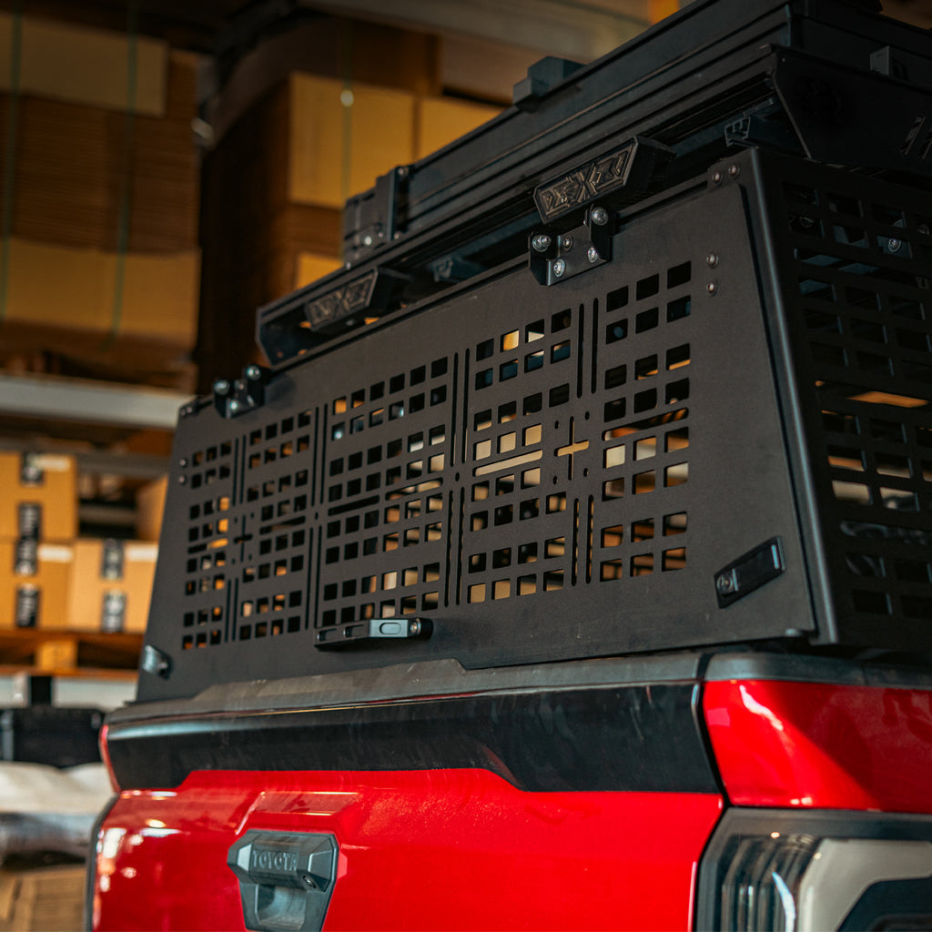 Closed MOLLE rear hatch on a Toyota Tacoma overland bed rack, low rear angle