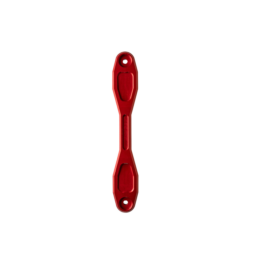 A red anodized battery hold down clamp with two mounting holes, shown vertically against a plain white background.