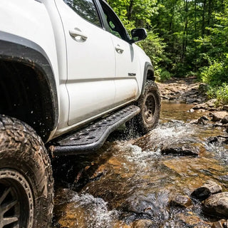 Step_Edition_rock_slider_on_Toyota_Tacoma_parked_on_a_rocky_trail