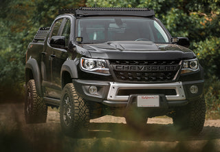 Front view of a black Chevy Colorado ZR2 equipped with Cali Raised LED Overland Bed Rack and off-road accessories