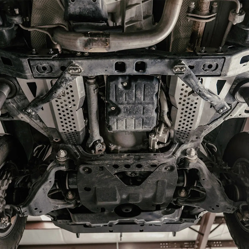 Cali Raised LED catalytic converter shields for the 2016-2023 Toyota Tacoma, driver- and passenger-side 12-gauge 304 stainless guards.